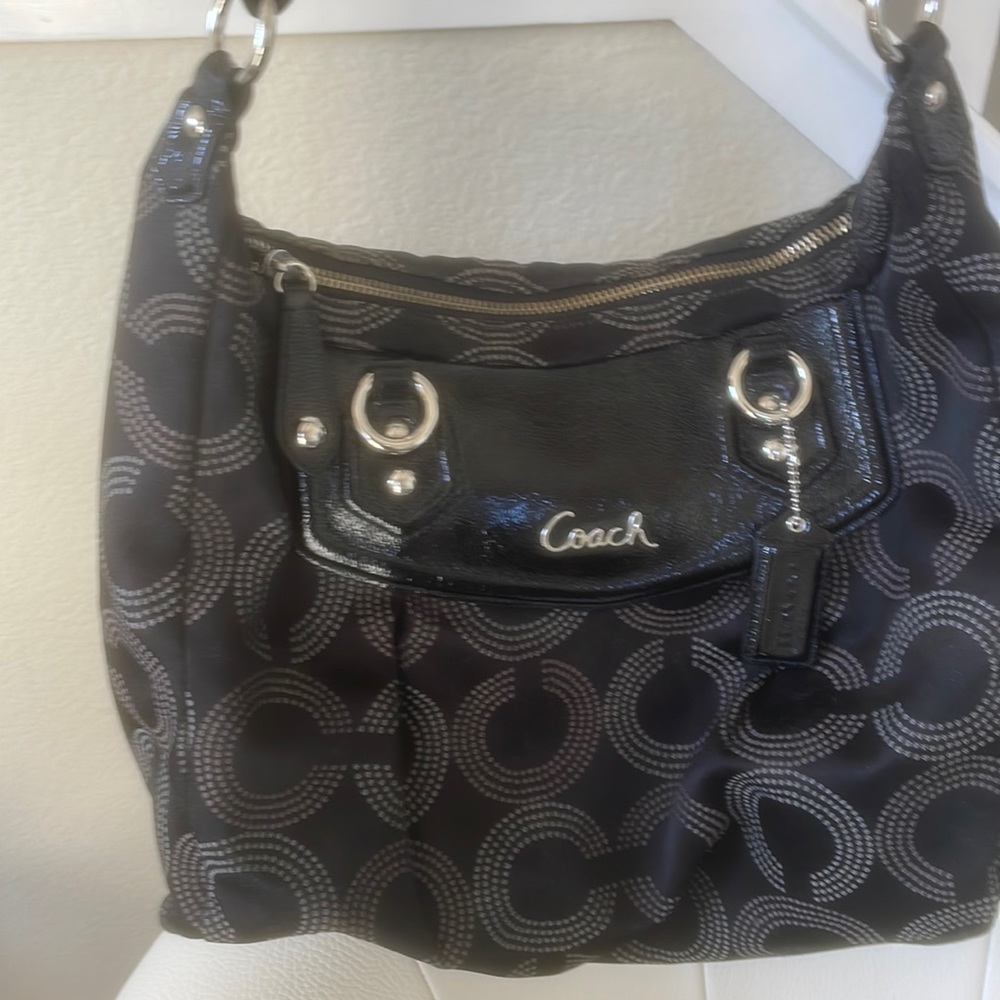 Genuine Coach purse. C logo pattern. Great everyday purse. Approx 16” w x 12” l